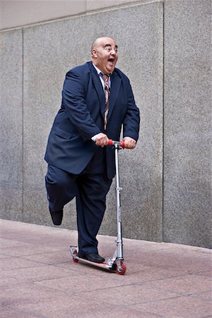 fat businessman full body - Businessman on Scooter Stock Photo - Premium Royalty-Free, Code: 600-01646038