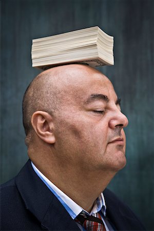 simsearch:600-02010065,k - Businessman with Stack of Cash on Head Fotografie stock - Premium Royalty-Free, Codice: 600-01646059