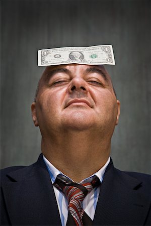 simsearch:700-02643197,k - Businessman with Dollar Bill on Head Stock Photo - Premium Royalty-Free, Code: 600-01646061