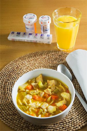 simsearch:600-01646073,k - Chicken Soup with Orange Juice and Pills Stock Photo - Premium Royalty-Free, Code: 600-01646072