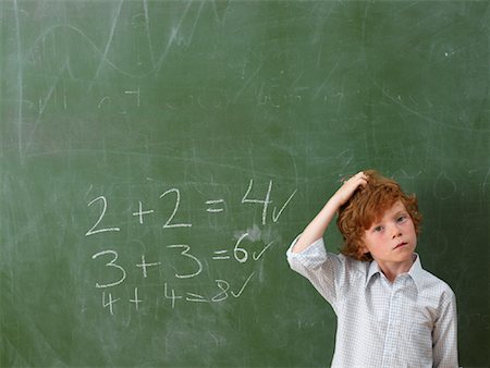 private school - Boy Standing at Blackboard Foto de stock - Sin royalties Premium, Código: 600-01646287