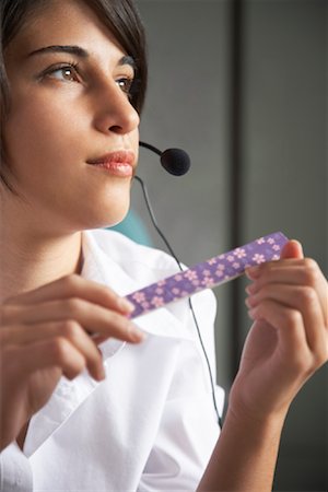 Businesswoman Filing Fingernails Foto de stock - Royalty Free Premium, Número: 600-01646436