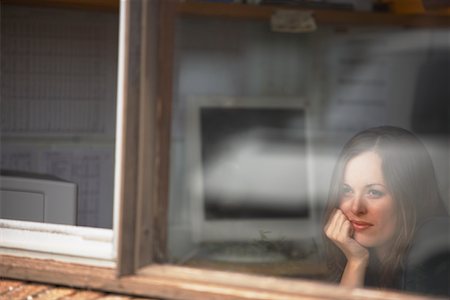 Businesswoman Looking Out Window Stock Photo - Premium Royalty-Free, Code: 600-01646448