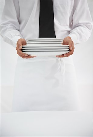 simsearch:600-01646507,k - Waiter Holding Stack of Plates Foto de stock - Sin royalties Premium, Código: 600-01646496