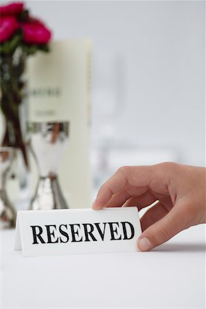 setting table and one person - Reserved Sign Stock Photo - Premium Royalty-Free, Code: 600-01646524