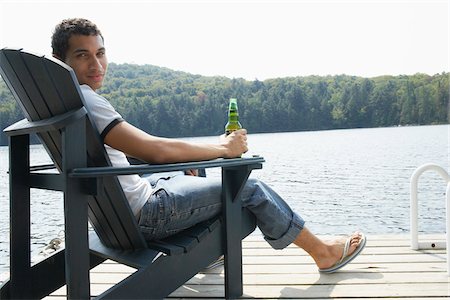 relaxation masterfile - Man Relaxing on Dock Stock Photo - Premium Royalty-Free, Code: 600-01670918