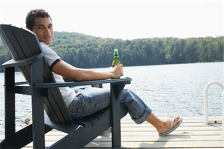 Man Relaxing on Dock Foto de stock - Sin royalties Premium, Código: 600-01670918