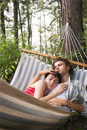 pictures of men sleeping in hammocks - Couple in Hammock Stock Photo - Premium Royalty-Free, Code: 600-01670942