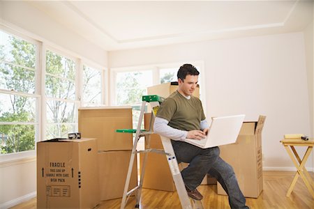 Man Moving Into New Home Stock Photo - Premium Royalty-Free, Code: 600-01694090