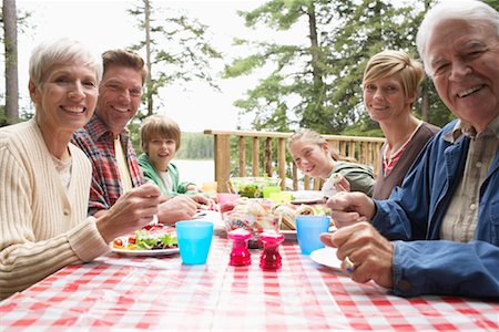 plate outdoor summer table family - Family at Table Stock Photo - Premium Royalty-Free, Code: 600-01694198