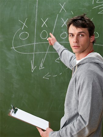 simsearch:600-01695349,k - Coach Writing on Blackboard Stock Photo - Premium Royalty-Free, Code: 600-01695296