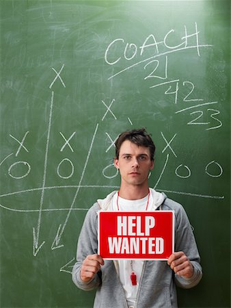 Coach Holding Help Wanted Sign Stock Photo - Premium Royalty-Free, Code: 600-01695297