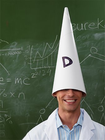 Man Wearing Dunce Cap Foto de stock - Sin royalties Premium, Código: 600-01695334