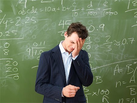 exasperated teacher - Teacher in Front of Blackboard Stock Photo - Premium Royalty-Free, Code: 600-01695345