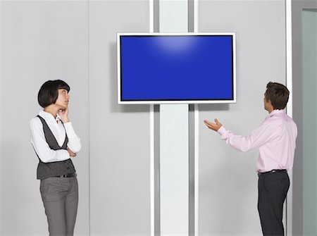 Business People Looking at Big Screen Television Foto de stock - Sin royalties Premium, Código: 600-01695651