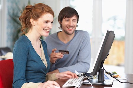 Couple with Credit Card and Computer Stock Photo - Premium Royalty-Free, Code: 600-01693966