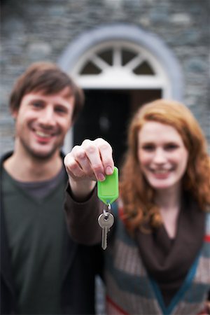 door house key - Couple with Key by House Stock Photo - Premium Royalty-Free, Code: 600-01693993