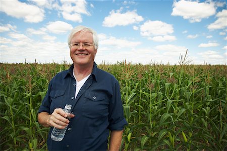 portrait outside work water - Farmer by Corn Field Stock Photo - Premium Royalty-Free, Code: 600-01716017