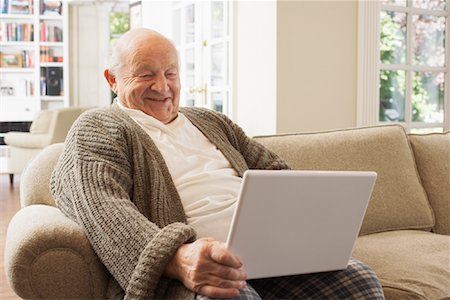 picture of old man in front of computer - Senior Man Using Laptop Computer Stock Photo - Premium Royalty-Free, Code: 600-01716117