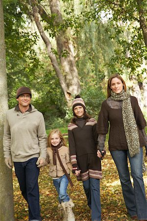 Portrait of Family Walking in Park, in Autumn Stock Photo - Premium Royalty-Free, Code: 600-01717651