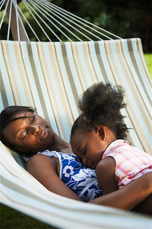 sleeping backyard - Mother and Daughter Sleeping in Hammock Stock Photo - Premium Royalty-Free, Code: 600-01717921