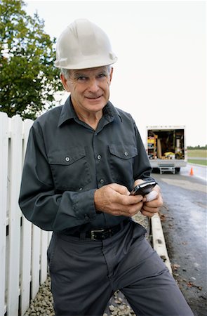 Construction Worker with Electronic Organizer Stock Photo - Premium Royalty-Free, Code: 600-01742616