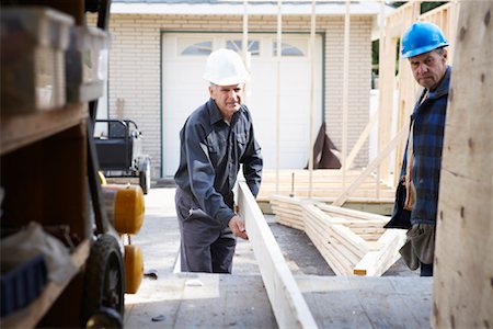 Construction Workers Building Addition on Home Stock Photo - Premium Royalty-Free, Code: 600-01742634