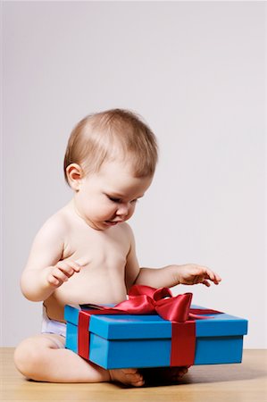 Baby with Gift Stock Photo - Premium Royalty-Free, Code: 600-01742775