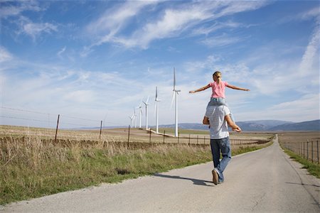 family wind energy - Young Girl on Father's Shoulders Stock Photo - Premium Royalty-Free, Code: 600-01743476