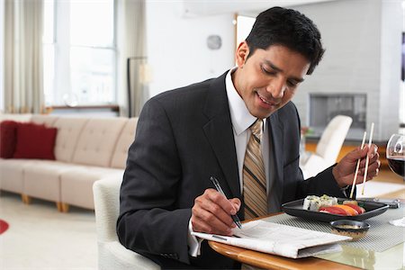 people eating fish food - Man with Newspaper and Sushi Stock Photo - Premium Royalty-Free, Code: 600-01753559