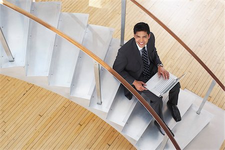 simsearch:600-01753614,k - Businessman on Steps with Laptop Computer Stock Photo - Premium Royalty-Free, Code: 600-01753594