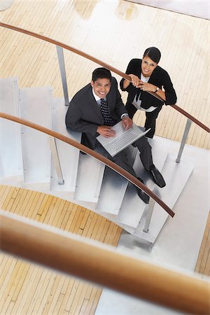 simsearch:600-01753614,k - Businessman and Woman on Staircase Stock Photo - Premium Royalty-Free, Code: 600-01753600