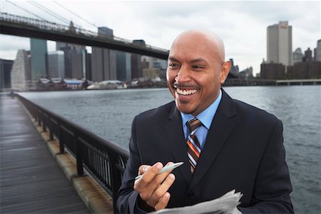 Businessman by Brooklyn Bridge, New York City, New York, USA Stock Photo - Premium Royalty-Free, Code: 600-01764116