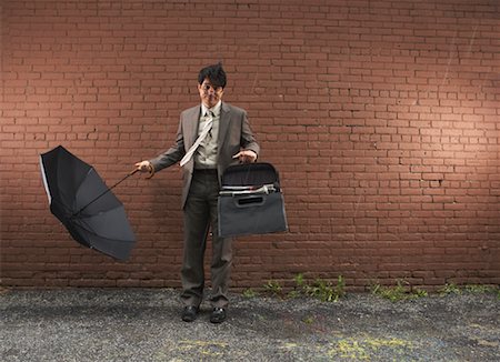 Homme d'affaires dans le vent, New York City, New York, USA Photographie de stock - Premium Libres de Droits, Code: 600-01764142