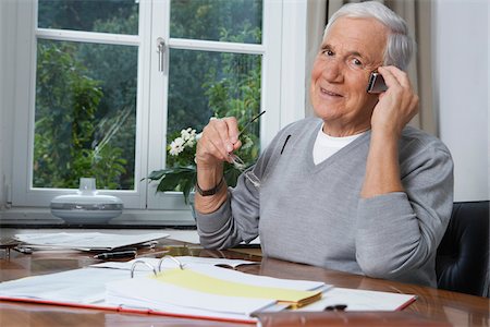 paying bills - Man Talking on Cellular Phone Stock Photo - Premium Royalty-Free, Code: 600-01764426