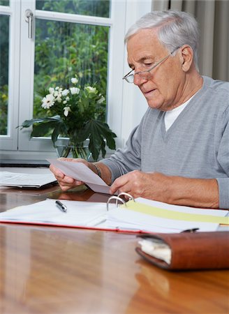 senior and saving - Man Paying Bills Stock Photo - Premium Royalty-Free, Code: 600-01764422