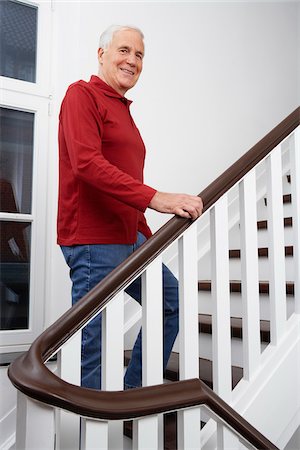 senior man eye contact one person - Man Ascending Stairs Stock Photo - Premium Royalty-Free, Code: 600-01764446