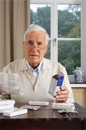 Man Taking Medication Stock Photo - Premium Royalty-Free, Code: 600-01764469