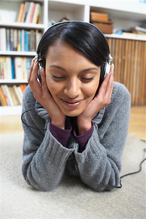 Woman Listening to Music Stock Photo - Premium Royalty-Free, Code: 600-01764694