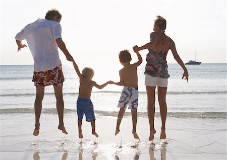 spanish women on the beach - Family Jumping Together on Beach, Majorca, Spain Stock Photo - Premium Royalty-Free, Code: 600-01764761