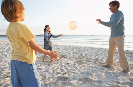 father and son play with a ball - Father Playing with Children on Beach, Majorca, Spain Stock Photo - Premium Royalty-Free, Code: 600-01764774