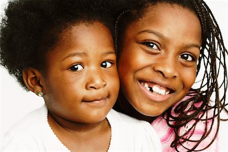 smiling family portrait closeup - Portrait of Sisters Stock Photo - Premium Royalty-Free, Code: 600-01764915