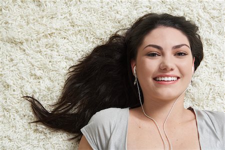 Teenaged Girl Listening to Music Stock Photo - Premium Royalty-Free, Code: 600-01787701