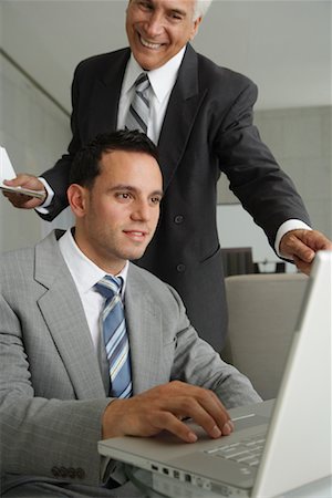 simsearch:700-02633759,k - Businessmen Using Laptop Computer Stock Photo - Premium Royalty-Free, Code: 600-01787721