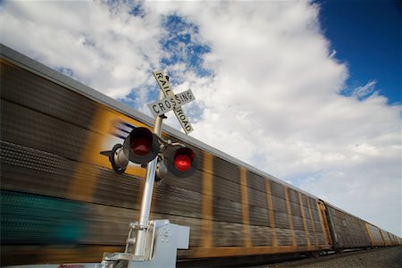 Train Crossing with Speeding Train, near Casa Grande, Arizona, USA Stock Photo - Premium Royalty-Free, Code: 600-01788170