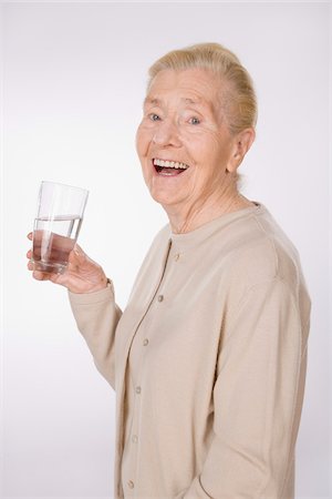 simsearch:600-01879154,k - Woman Drinking Water Fotografie stock - Premium Royalty-Free, Codice: 600-01788463