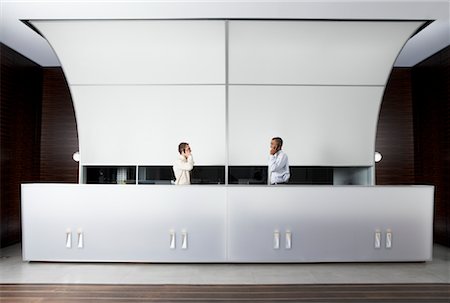 secretary and her telephone - Receptionists at Desk Stock Photo - Premium Royalty-Free, Code: 600-01788799