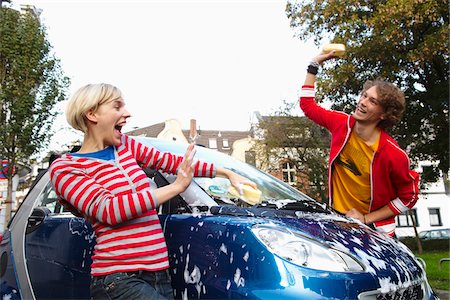sponge and water - Couple Washing Car, Play Fighting Stock Photo - Premium Royalty-Free, Code: 600-01827057