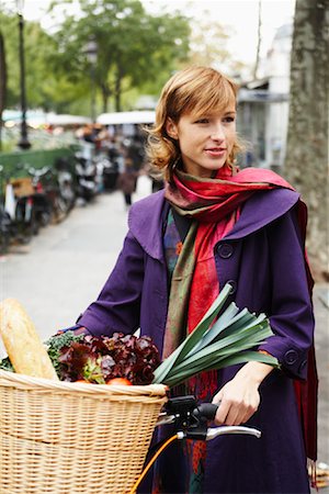 Woman with Basket of Vegetables on Bicycle Stock Photo - Premium Royalty-Free, Code: 600-01827652