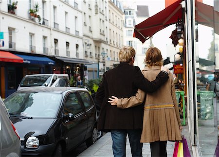 paris storefronts - Couple Walking with Arms Around Each Other Stock Photo - Premium Royalty-Free, Code: 600-01827672